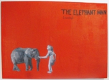 The Elephant Man is feeding an elephant